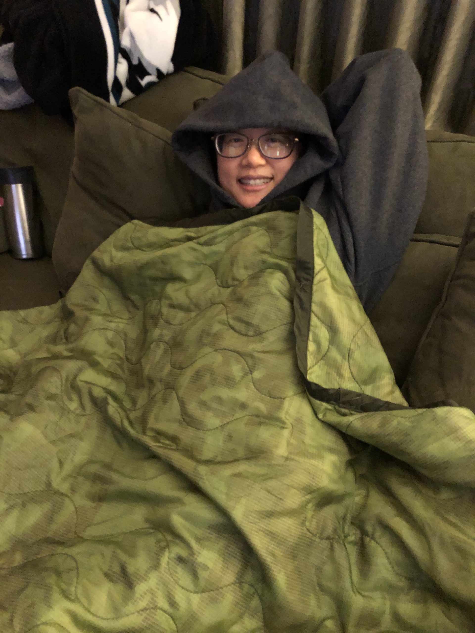 Judi sick huddled in blankets